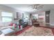The living room features a large window, a ceiling fan, a leather recliner, and nice decor at 505 Jones Pl, Martinsville, IN 46151