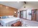 Spacious main bedroom with vaulted ceilings, custom paneling and a stylish en-suite bathroom at 505 Jones Pl, Martinsville, IN 46151