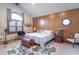 Comfortable main bedroom with vaulted ceilings, natural light and custom paneling at 505 Jones Pl, Martinsville, IN 46151