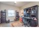 Cozy home office featuring hardwood floors, natural light, built-in shelving, and custom workspace at 505 Jones Pl, Martinsville, IN 46151