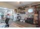 Home office adjacent to kitchen with hardwood floors, natural light, built-in shelving, and custom workspace at 505 Jones Pl, Martinsville, IN 46151