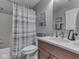 Bathroom featuring a shower with a curtain, a countertop, and natural lighting at 5351 Abbington Ave, Plainfield, IN 46168