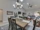 Well-lit dining area with a view to the living room, showing spacious layout and design elements at 5351 Abbington Ave, Plainfield, IN 46168