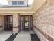 Inviting front entrance featuring a decorative wreath on the front door and a welcome sign at 5351 Abbington Ave, Plainfield, IN 46168