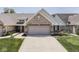 Charming single-story home with a brick facade, attached garage, and well-manicured lawn at 5351 Abbington Ave, Plainfield, IN 46168