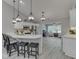 Bright kitchen featuring a large center island, pendant lighting, and white cabinetry at 5351 Abbington Ave, Plainfield, IN 46168