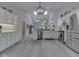 Spacious kitchen with stainless steel appliances, white cabinets, and an open layout connected to the living spaces at 5351 Abbington Ave, Plainfield, IN 46168