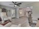 Open-concept living room leading to a modern kitchen with stainless steel appliances at 5351 Abbington Ave, Plainfield, IN 46168