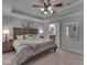 Bedroom featuring a ceiling fan, and an open door to the ensuite bathroom at 5351 Abbington Ave, Plainfield, IN 46168