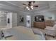 Main bedroom showcasing a ceiling fan, and ensuite bathroom with a glass shower at 5351 Abbington Ave, Plainfield, IN 46168