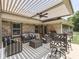 Inviting outdoor patio with comfortable seating, a fan, and a retractable sun shade for relaxation at 5351 Abbington Ave, Plainfield, IN 46168