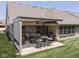Beautiful outdoor patio area featuring a pergola, comfortable seating, and a serene backyard at 5351 Abbington Ave, Plainfield, IN 46168