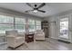 Sunroom boasting bright natural light, swivel chairs and access to the outdoors at 5351 Abbington Ave, Plainfield, IN 46168