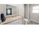 Bright bathroom featuring granite countertop, white cabinets, and a separate shower at 5625 Winston Dr, Indianapolis, IN 46226