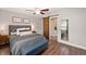 This bedroom features great natural light, stylish decor, and an attached bathroom with a sliding barn door at 5625 Winston Dr, Indianapolis, IN 46226