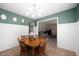 Lovely dining room with natural wood table and seating plus views to the living room at 5625 Winston Dr, Indianapolis, IN 46226