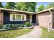 Charming home featuring manicured landscaping, brick accents, and a welcoming entrance at 5625 Winston Dr, Indianapolis, IN 46226