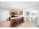 Spacious kitchen with granite countertops, modern appliances, bar seating and natural lighting at 5625 Winston Dr, Indianapolis, IN 46226