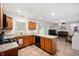 Modern kitchen boasts granite countertops, stainless steel appliances, and opens to the living area at 5625 Winston Dr, Indianapolis, IN 46226