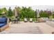 Great backyard with seating around an outdoor firepit and patio furniture on the lawn at 5684 Autumn Trl, Brownsburg, IN 46112