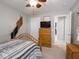 This bedroom boasts a ceiling fan, plush carpet, and an abundance of storage space at 5684 Autumn Trl, Brownsburg, IN 46112