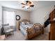 This bedroom features neutral walls, plush carpet, and a ceiling fan for added comfort at 5684 Autumn Trl, Brownsburg, IN 46112