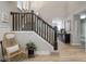 Spacious foyer with a staircase and an open view to the living areas at 5684 Autumn Trl, Brownsburg, IN 46112