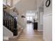 Light-filled entryway featuring wood floors, staircase, and decorative accents at 5684 Autumn Trl, Brownsburg, IN 46112