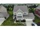 Charming two-story home featuring a well-maintained lawn and an attached two-car garage at 5684 Autumn Trl, Brownsburg, IN 46112