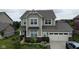 Beautiful two-story home with a well-manicured lawn and attached two car garage at 5684 Autumn Trl, Brownsburg, IN 46112