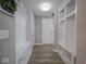 Hallway featuring built-in shelves and benches for storage, adding functionality and style at 5684 Autumn Trl, Brownsburg, IN 46112