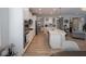 Bright kitchen boasts white cabinetry, stainless steel appliances, and an island with countertop seating at 5684 Autumn Trl, Brownsburg, IN 46112