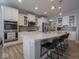 Modern kitchen with stainless steel appliances, quartz countertops, and a spacious island at 5684 Autumn Trl, Brownsburg, IN 46112
