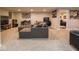 Spacious living room features ample seating, stylish decor and a doorway leading to another room at 5684 Autumn Trl, Brownsburg, IN 46112