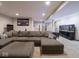 Relaxing living room featuring a comfortable sectional, fish tank and exercise area at 5684 Autumn Trl, Brownsburg, IN 46112