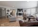Inviting living area with a cozy fireplace, comfortable seating, and lots of natural light at 5684 Autumn Trl, Brownsburg, IN 46112