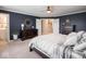 This main bedroom boasts plush carpet, dark wood furnishings, and stylish decor at 5684 Autumn Trl, Brownsburg, IN 46112