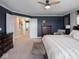 Cozy main bedroom boasts plush carpet, dark wood furnishings, and stylish decor at 5684 Autumn Trl, Brownsburg, IN 46112