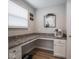Desk area featuring built-in shelves, drawers, and great lighting, perfect for a home office at 5684 Autumn Trl, Brownsburg, IN 46112