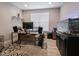 Bright office with a large desk, computer setup, and a spacious aquarium at 5684 Autumn Trl, Brownsburg, IN 46112