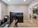 Comfortable office space with an aquarium, desk, and view into the entry at 5684 Autumn Trl, Brownsburg, IN 46112