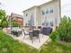 Outdoor patio area with built-in seating, grill and dining area for entertainment at 5684 Autumn Trl, Brownsburg, IN 46112
