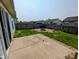 Fenced backyard featuring a patio, grassy area, and stone fire pit for outdoor enjoyment at 581 Grassy Bend Dr, Greenwood, IN 46143