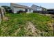 Large fenced backyard with grassy area and a patio, perfect for pets, Gathering and outdoor activities at 581 Grassy Bend Dr, Greenwood, IN 46143