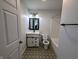 Beautiful bathroom with patterned tile floor, and modern vanity at 581 Grassy Bend Dr, Greenwood, IN 46143