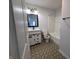 Modern bathroom with patterned tile floor, and farmhouse style vanity at 581 Grassy Bend Dr, Greenwood, IN 46143