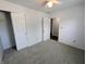 Bedroom with neutral carpet, ceiling fan, and closet at 581 Grassy Bend Dr, Greenwood, IN 46143