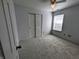 A bright bedroom features carpet flooring, a ceiling fan, and a double door closet at 581 Grassy Bend Dr, Greenwood, IN 46143