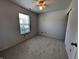 Bedroom with neutral carpet, ceiling fan, and window at 581 Grassy Bend Dr, Greenwood, IN 46143