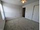 Bedroom features carpet flooring, a ceiling fan, a closet, and natural light at 581 Grassy Bend Dr, Greenwood, IN 46143
